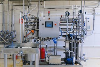 Detailed view of complex industrial machinery in a modern factory environment.